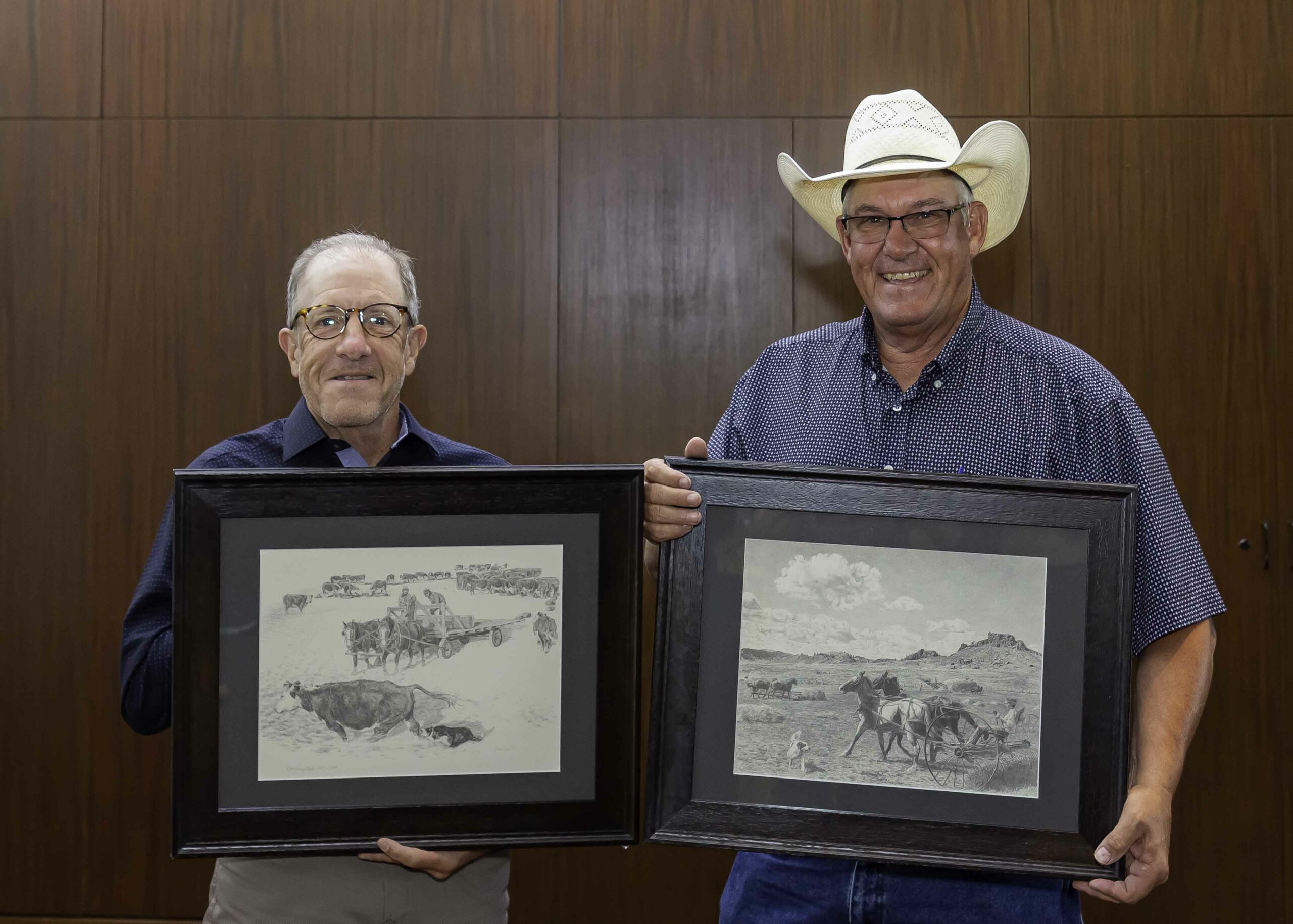 Mark Frasier and Kent Wasson hold drawings